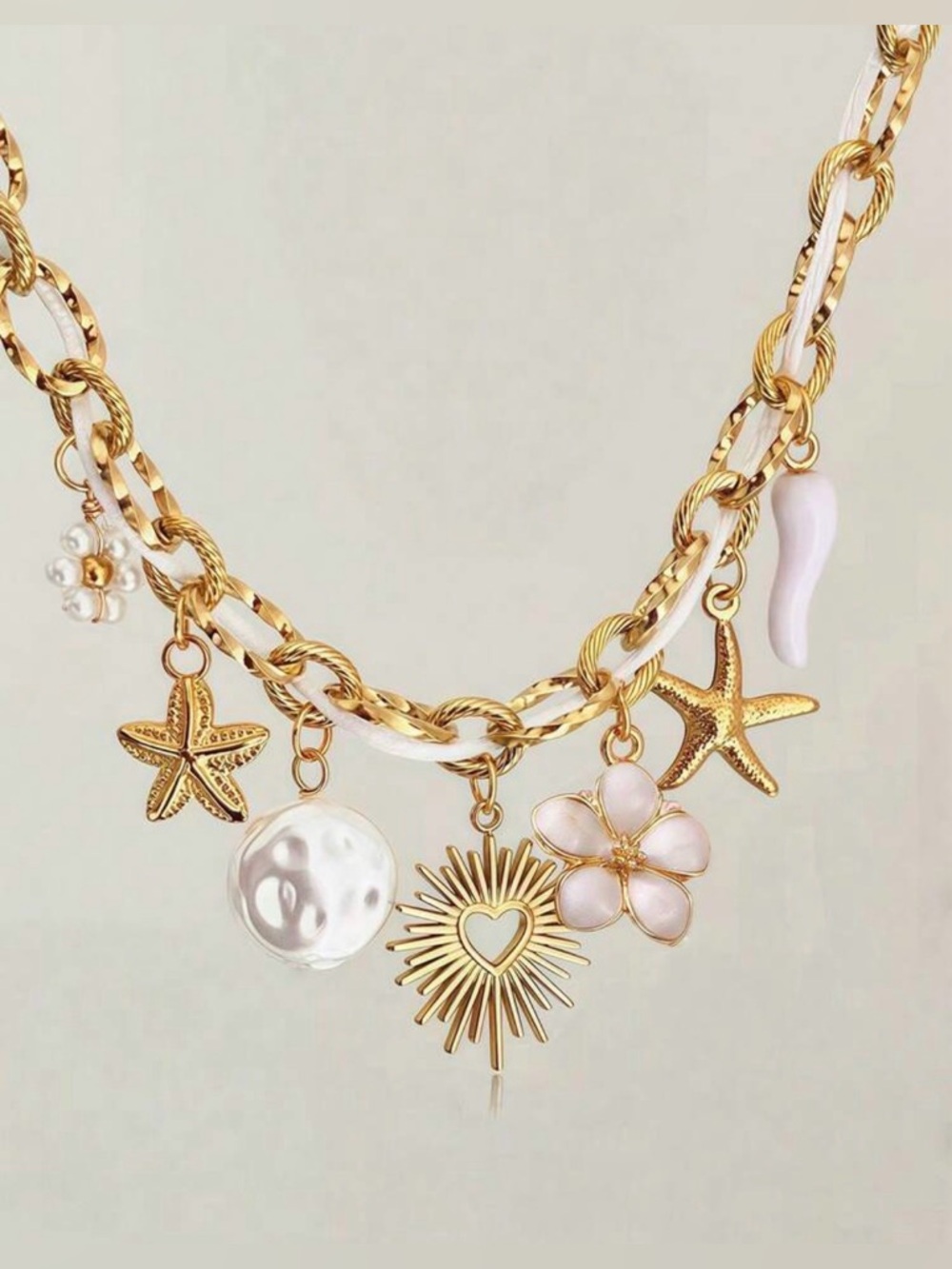 Anthropologie Gold and White Beach Charm Necklace